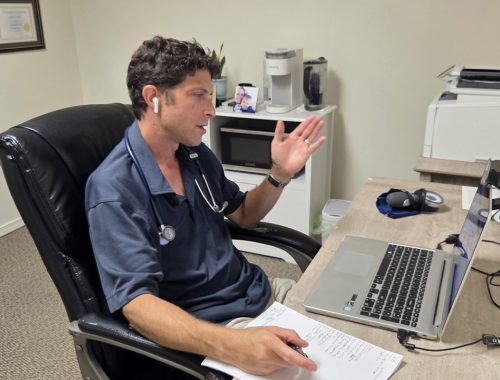 Dr. Todd A. Born, naturopathic physician, conducting a telehealth consultation with a patient.